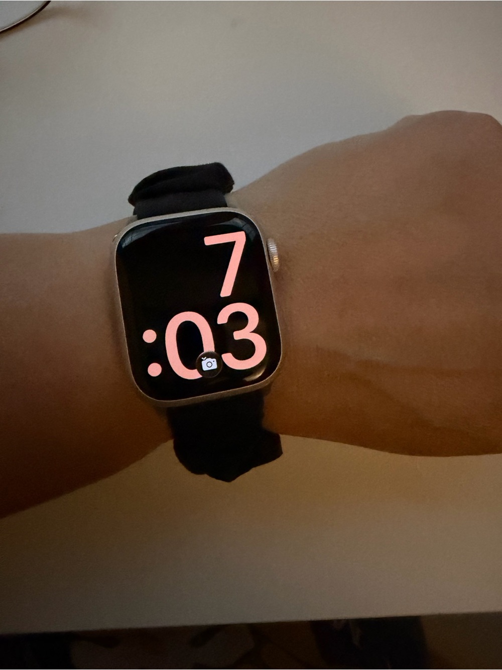 Apple Watch with Black Sport Loop and Pink Numeral Face